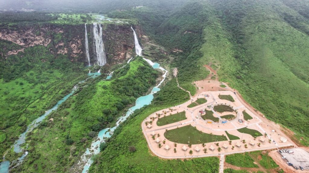 a waterfall next to a park in Salalah