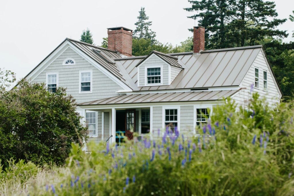 a house with a large verdant garden - Exterior renovations improve the appearance of a home