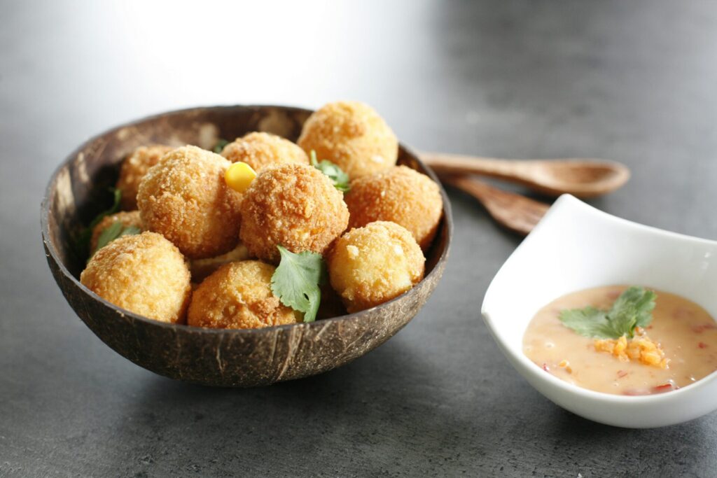 Fried balls with dipping sauce.