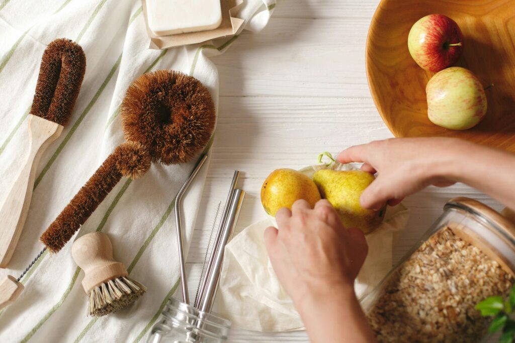 Hands preparing fresh fruits and grains