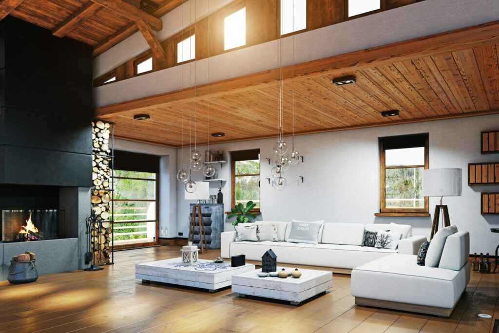 a living room home interior with a fireplace and white couches