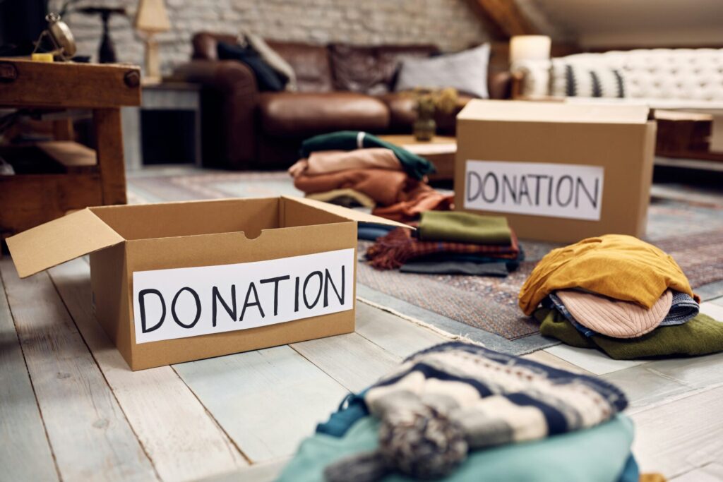 Donation boxes depicting that decluttering is one of the top  moving tips