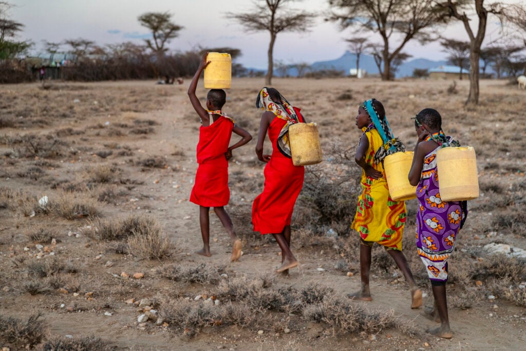 kids in africa carrying water