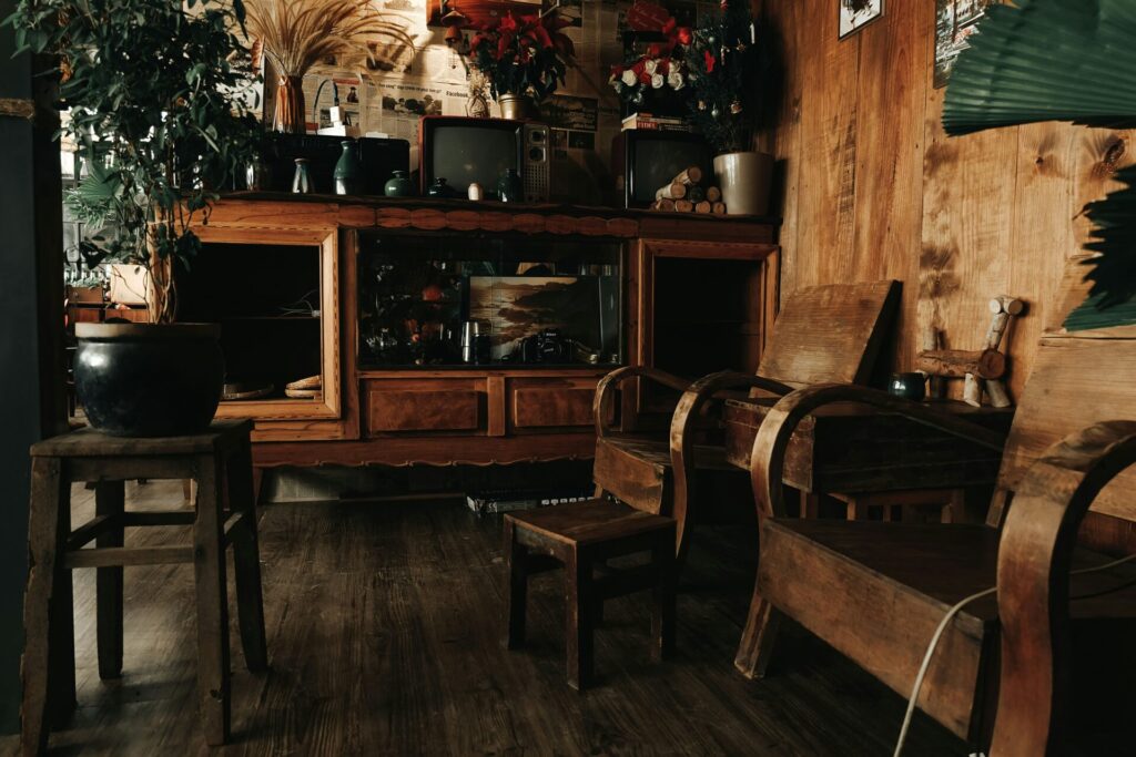 a room with wood furniture and a tv