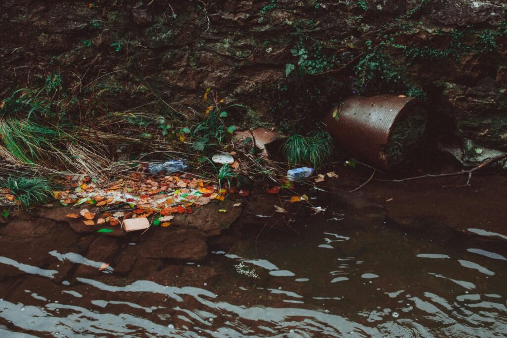 plastic poisoning a river bed