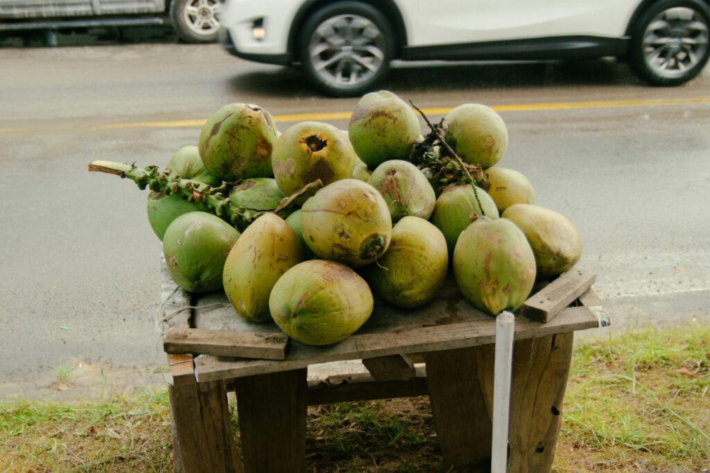 Fresh coconuts on a wooden table