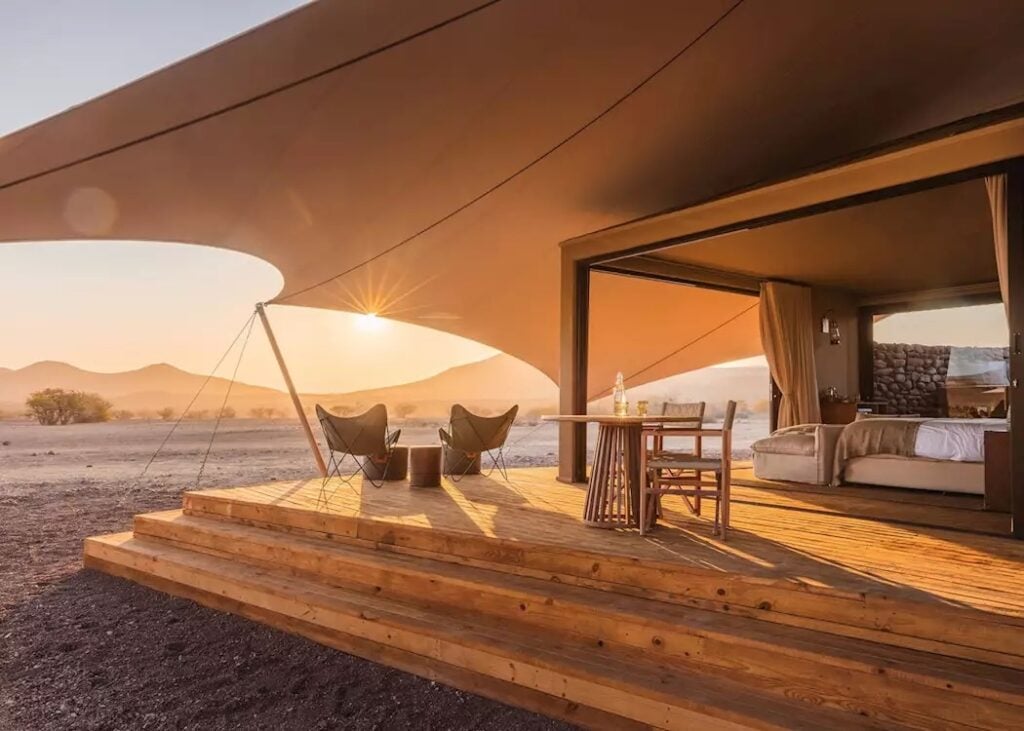 Serene desert camp at sunset.