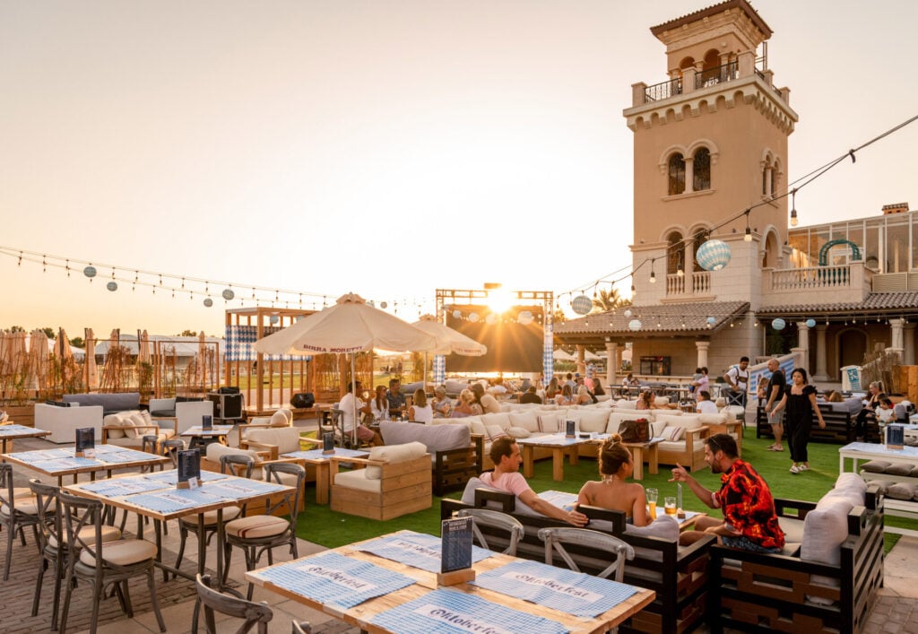 Outdoor dining with sunset ambiance.