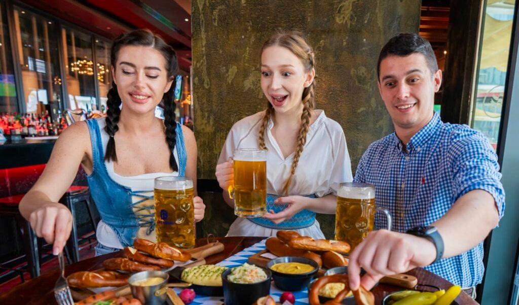Group enjoying food and drinks together.