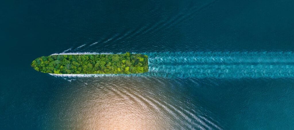 Boat surrounded by lush green island