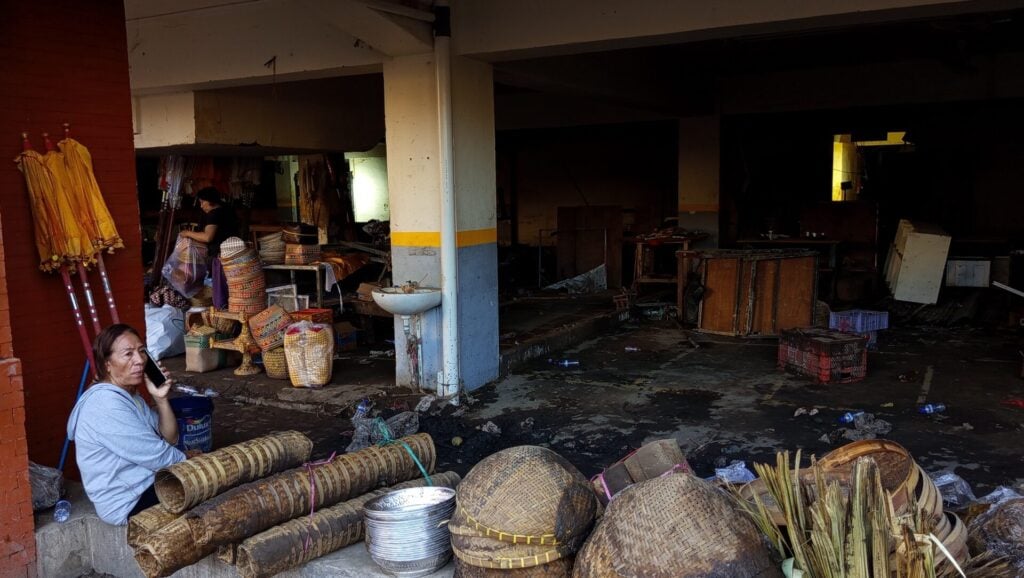 Market scene with various goods displayed.