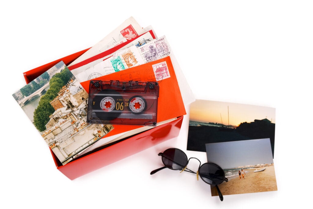 box of keepsakes with cassette and postcards 