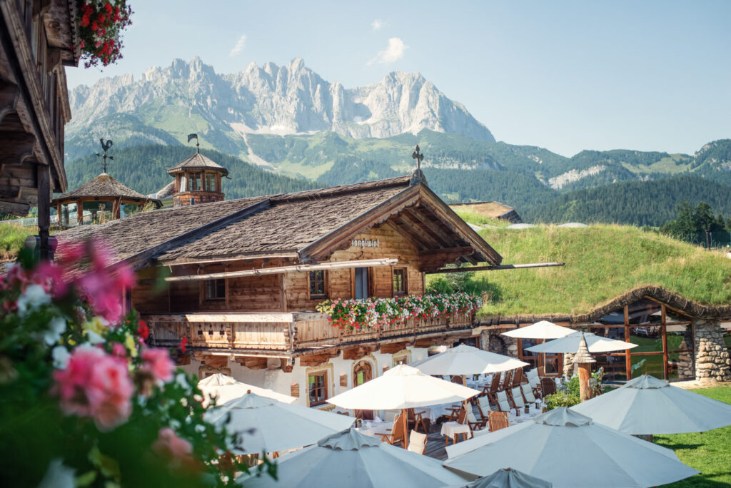 Charming alpine lodge view of stanglwirt with mountain backdrop