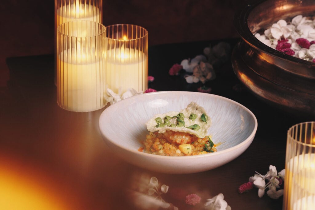 Elegant dish with candles and flowers