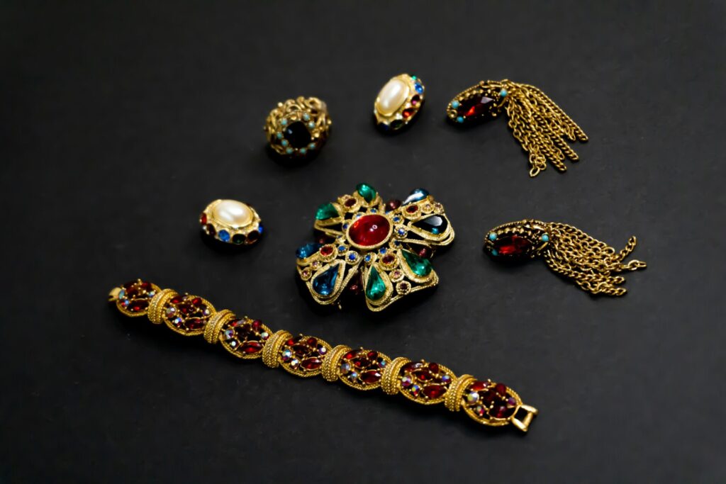 Colorful vintage jewelry on black background