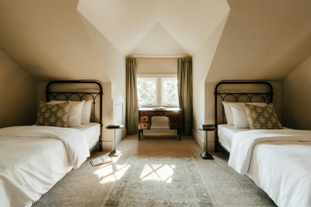 Cozy attic bedroom with twin beds.
