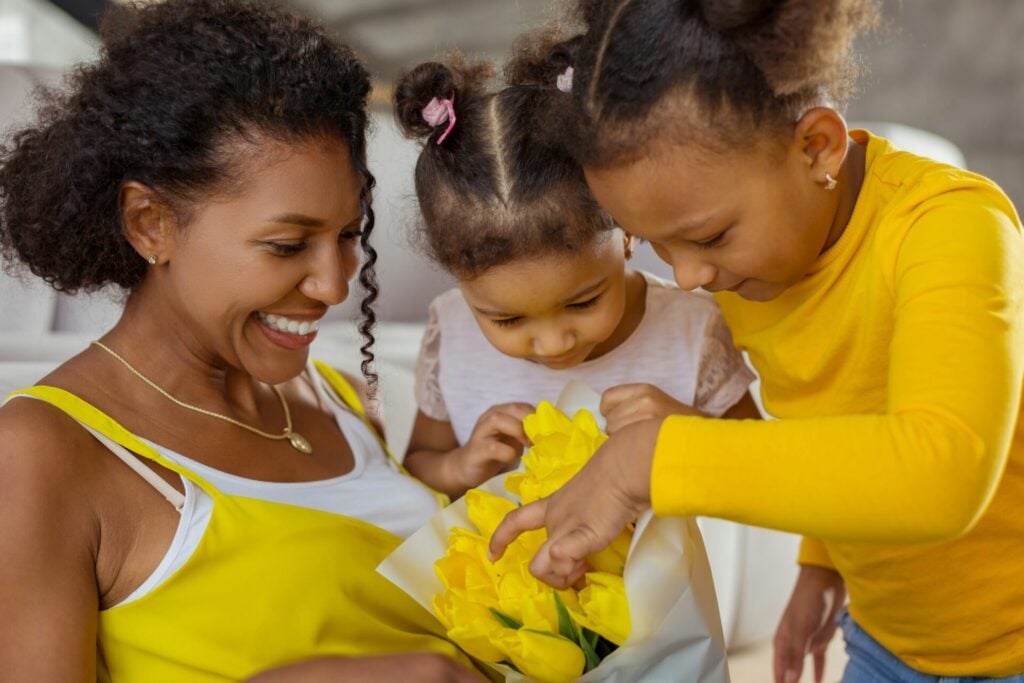 lady receiving yellow flowers wearing yellow
