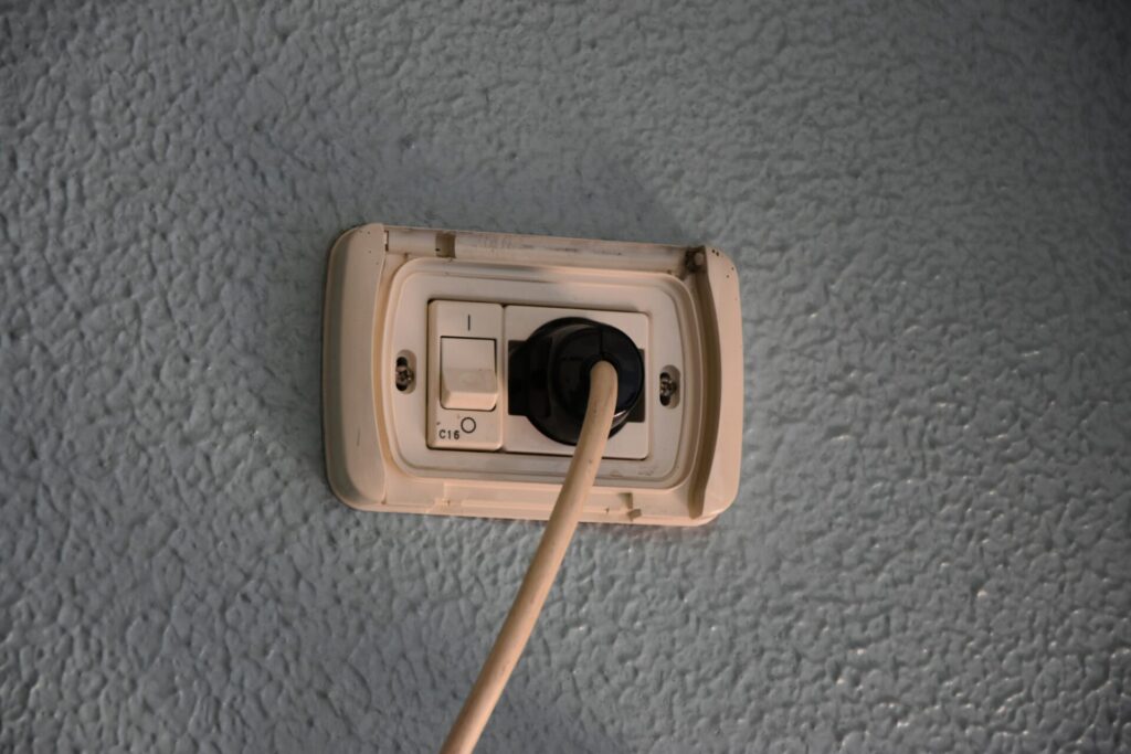 Electrical outlet with plugged cable