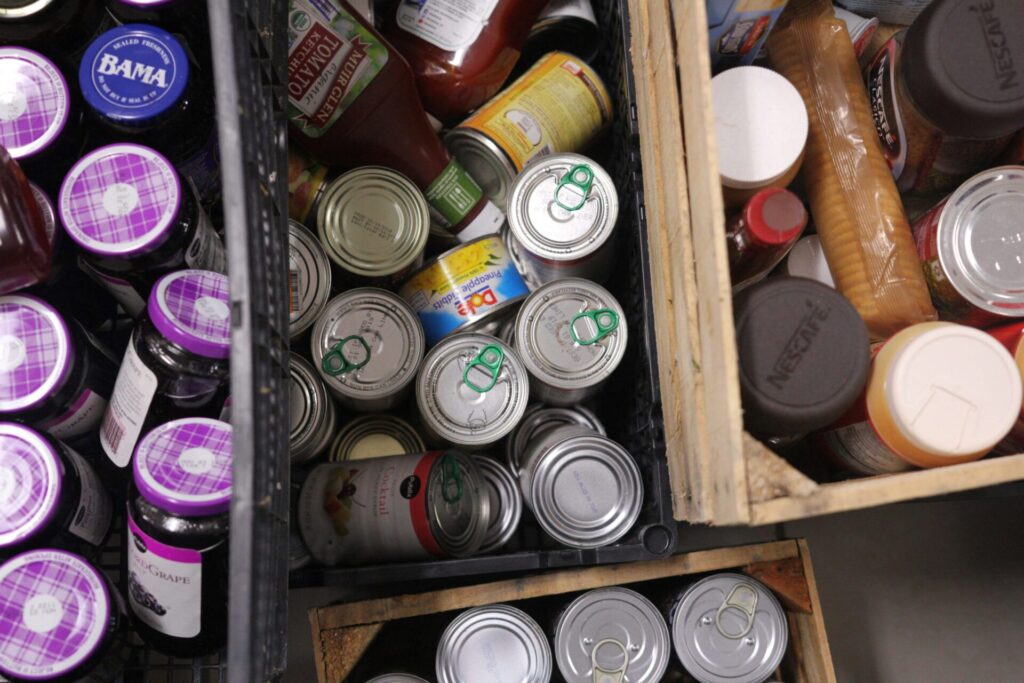 Shelves filled with assorted canned goods.