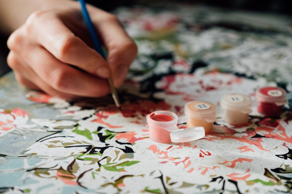 hand doing paint by numbers 