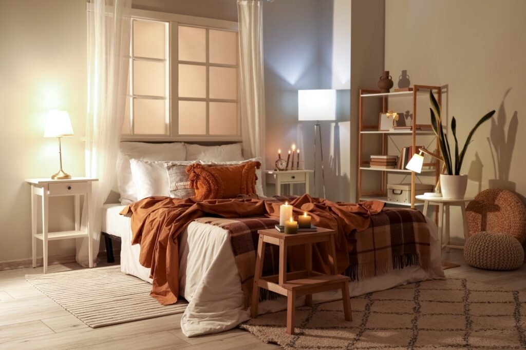 Cozy, warm-toned bedroom  with air purifying plants and natural lighting in a healthy home 