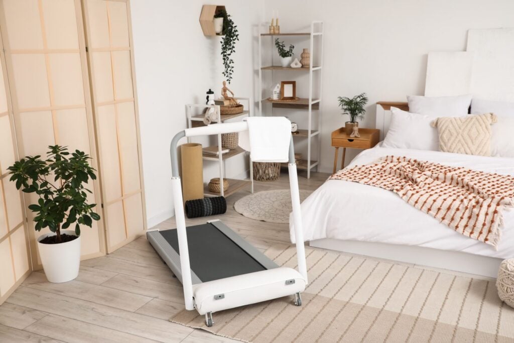 Modern bedroom with treadmill and decor