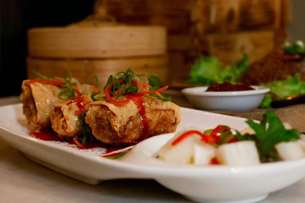Delicious spring rolls with garnishes served at the Lah Lah brunch
