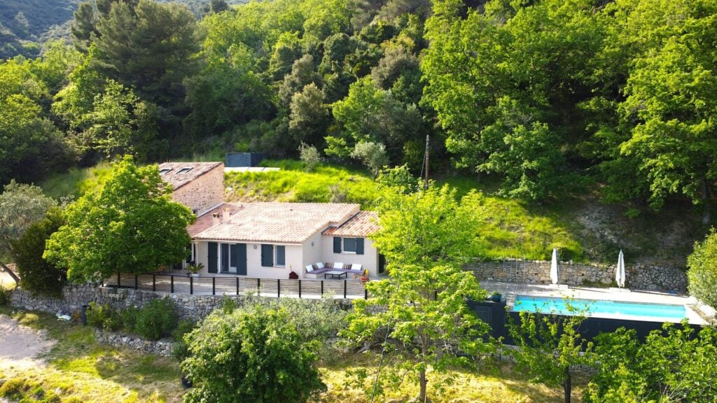 Villa surrounded by lush greenery and pool