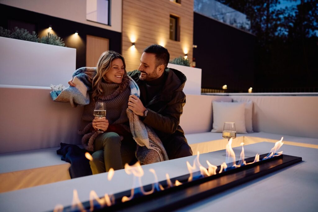 Couple enjoying evening by fire