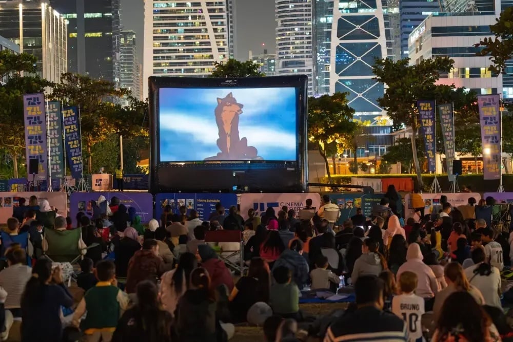 Outdoor movie screening with audience