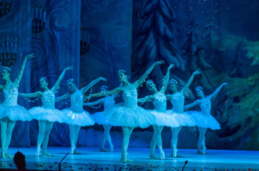 Ballet dancers performing in unison.