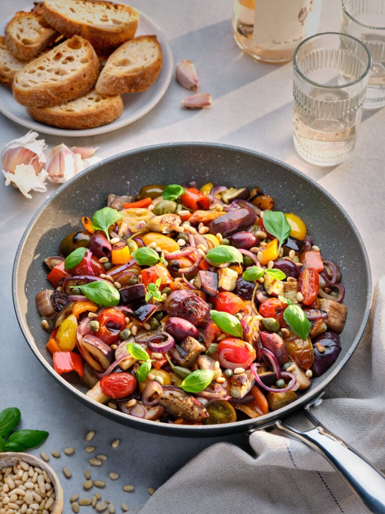 bowl of healthy fresh caponata in a stellar frying pan 