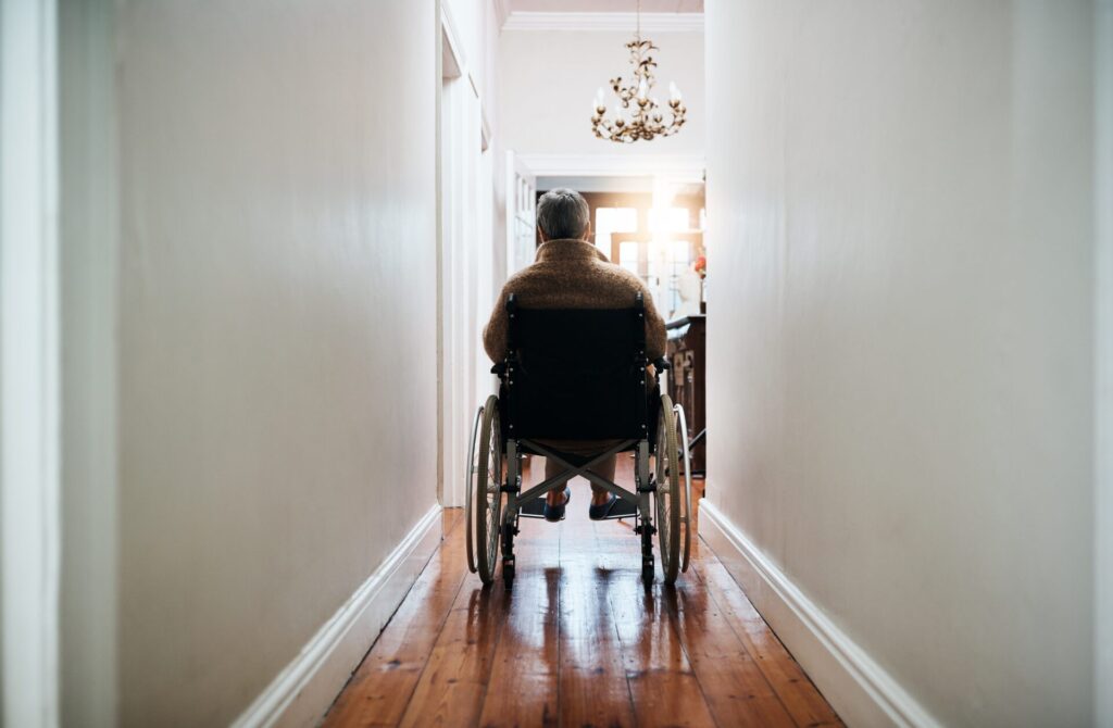 elderly man in wheelchair in home msde for long-term living