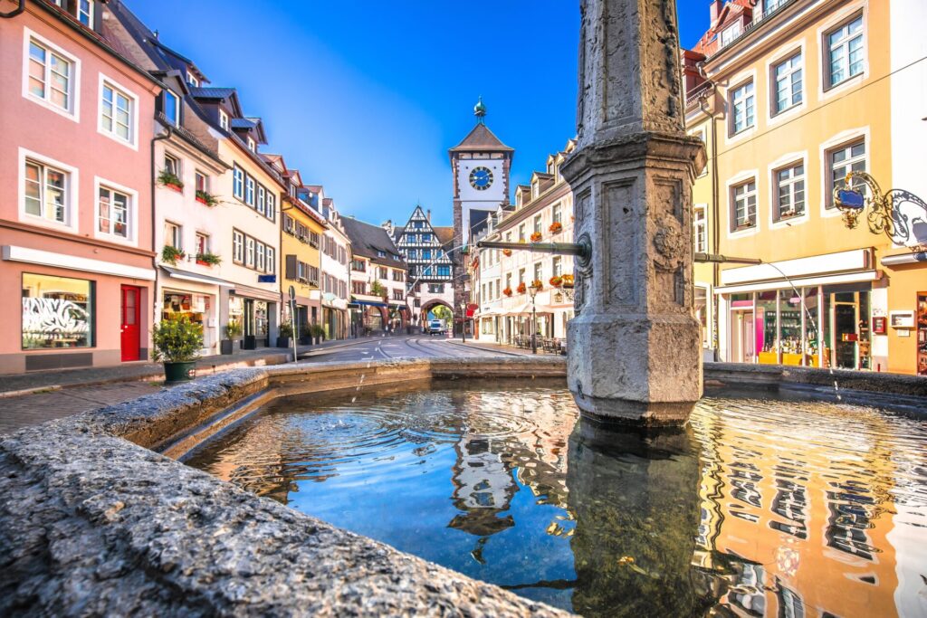 Freiburg town centre with well and old houses in pretty colours