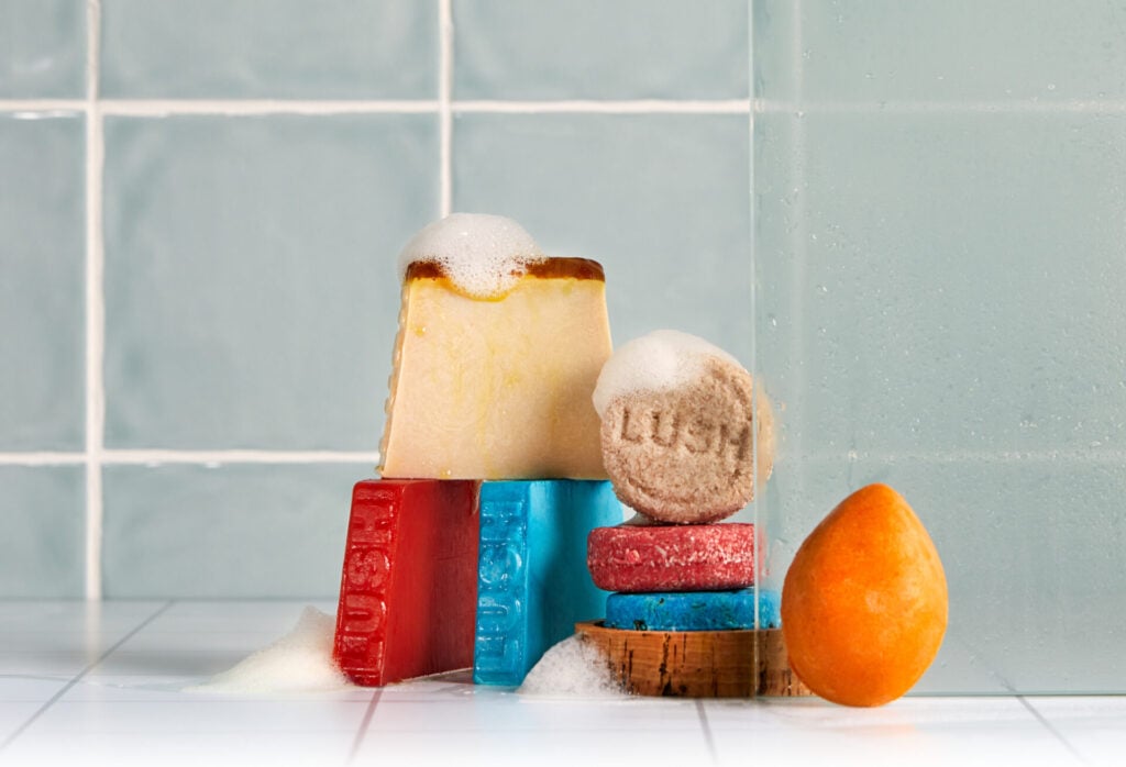 naked Lush products stacked in bathroom 