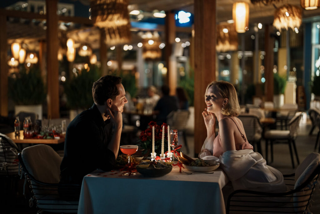 Valentine's night out couple gazing lovingly at one another 