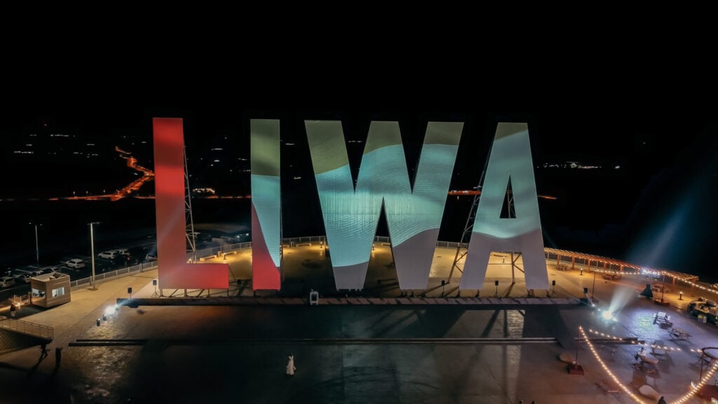 Colorful LIWA sign at night