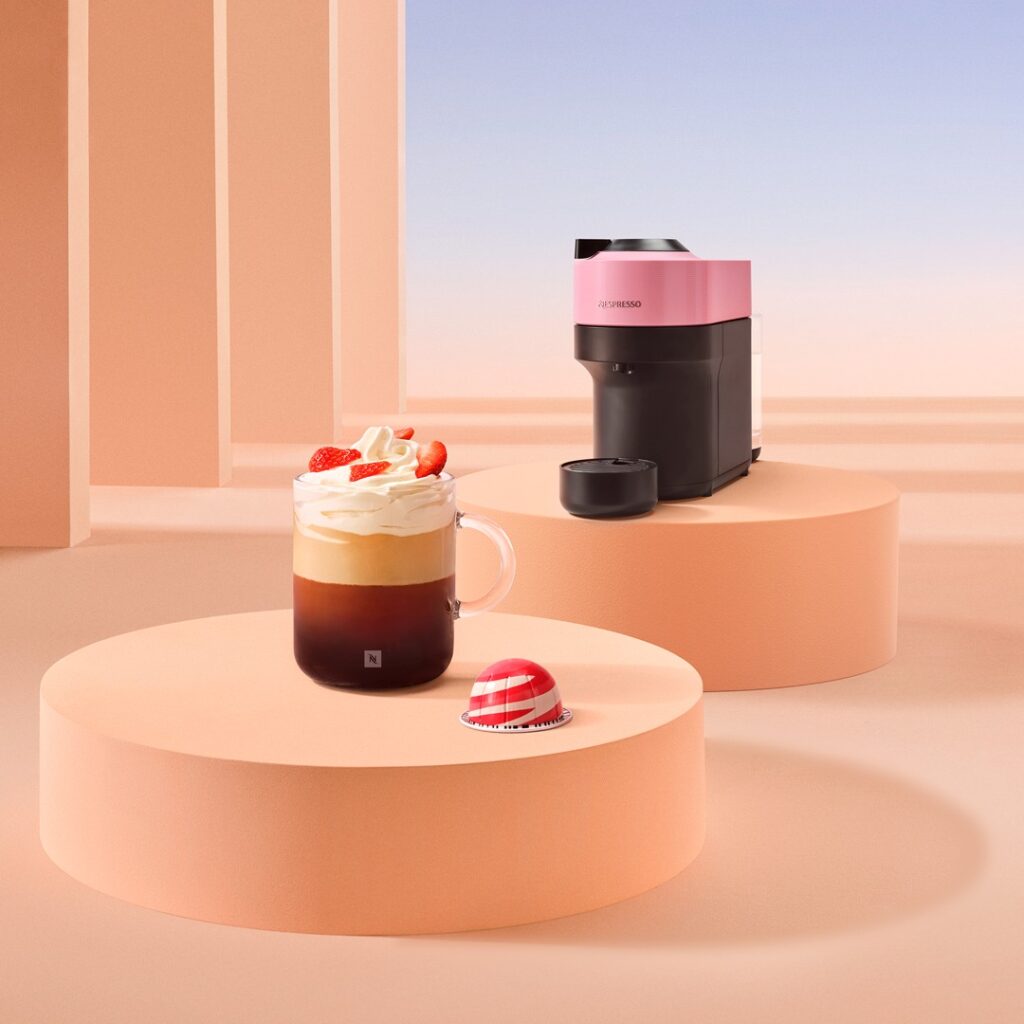 nespresso machine with latte with strawberries and cream on top