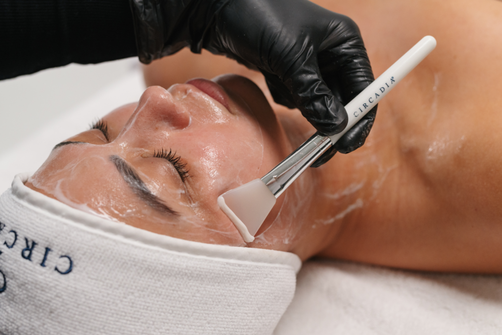 Lady lying down with eyes closed during beauty treatment 