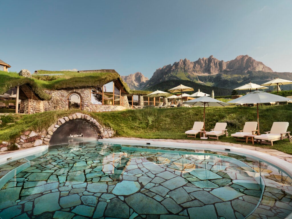 Scenic pool with mountain backdrop.