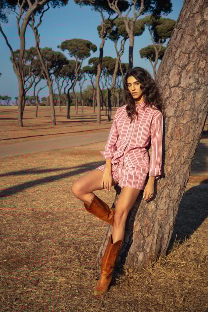 lady modelling KAĪYA clothing leaning on tree 