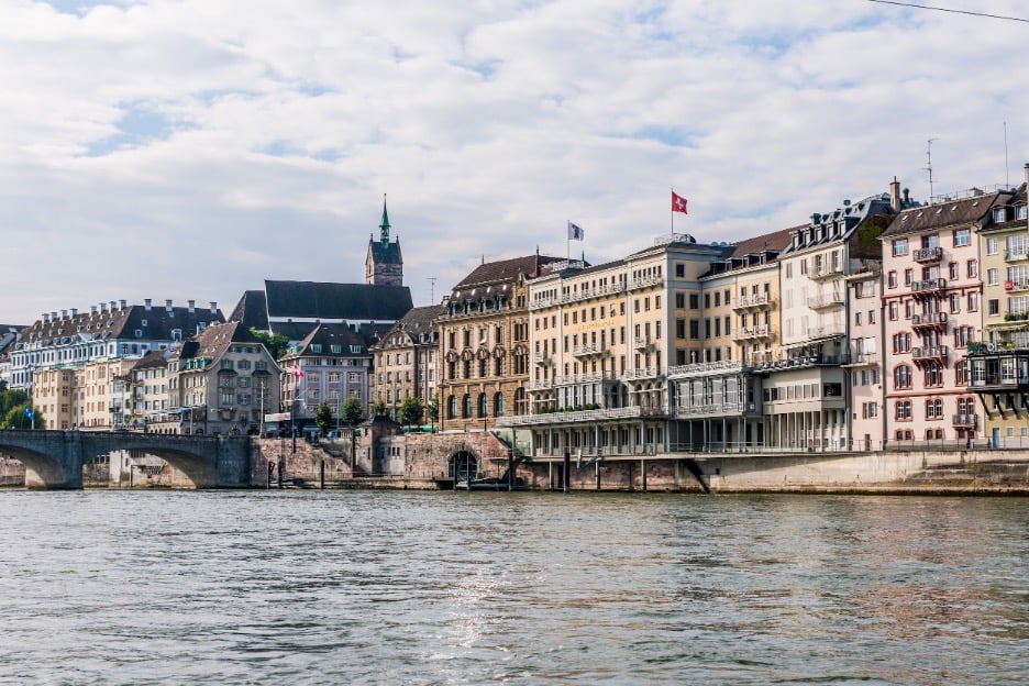 Riverfront view of Basel architecture.