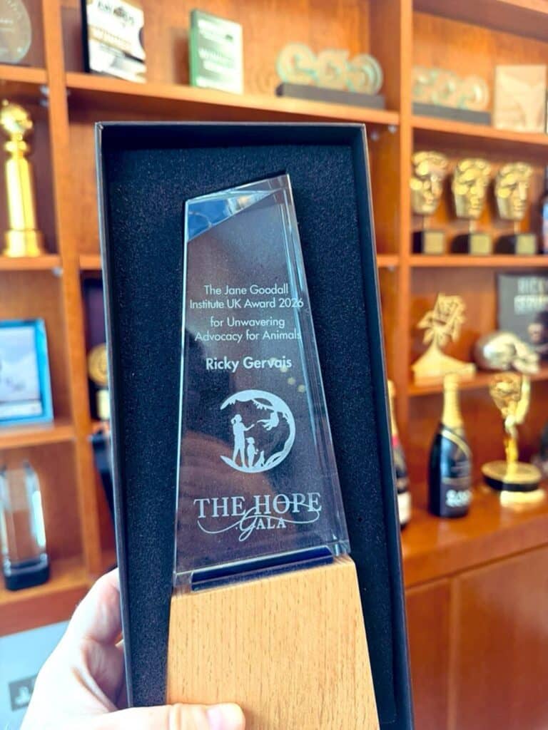 Ricky Gervais hand holding trophy