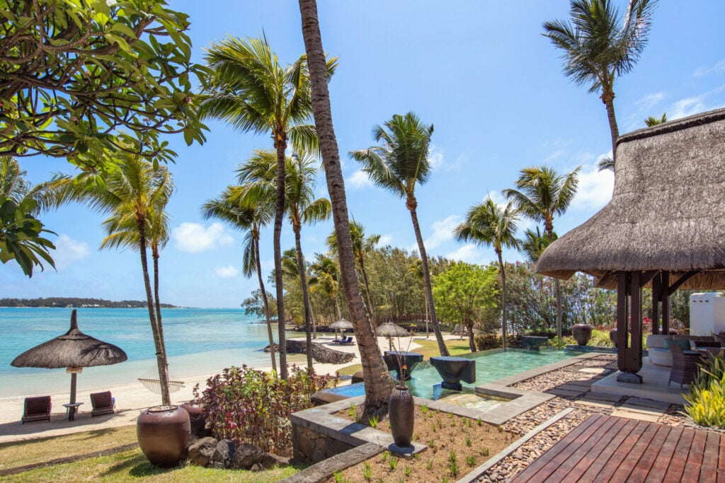 Mauritius resort with palm trees and turqouise sea as a recommended eid escapes location