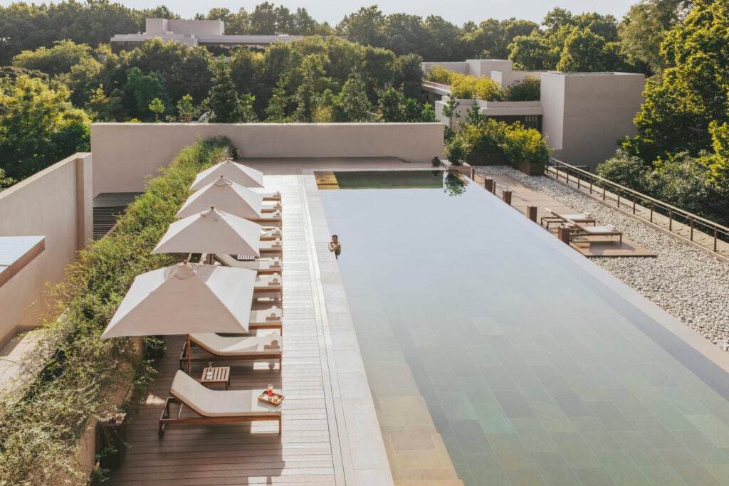 six senses swimming pool surrounded by trees 