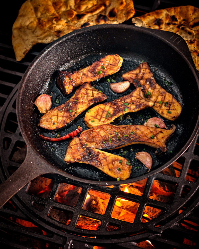 oyster mushrooms in a pan with garlic 
