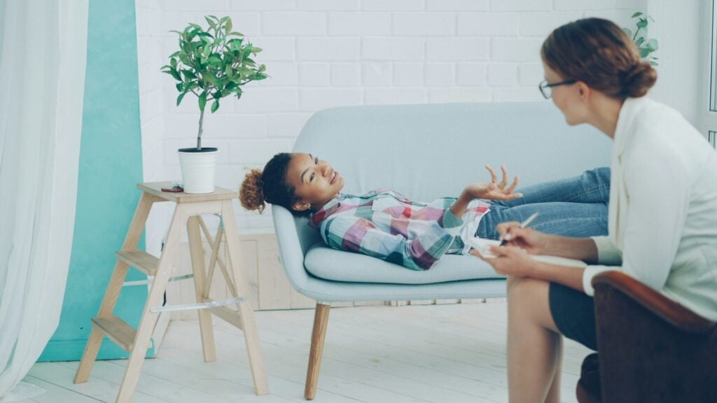 Counsellor with child ensuring student wellbeing 