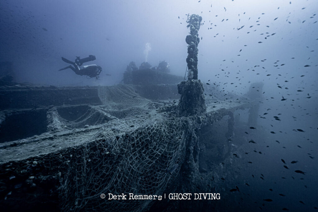 divers at a ship wreck