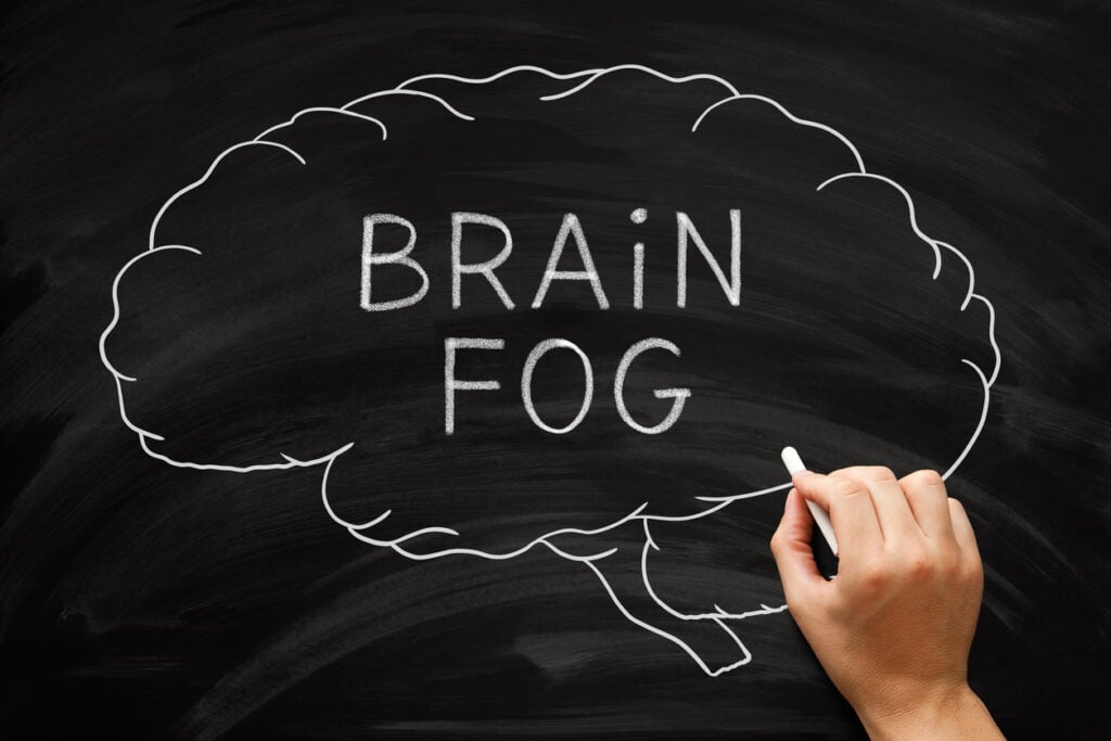 Hand drawing brain fog concept about memory problems, lack of mental clarity and an inability to focus.