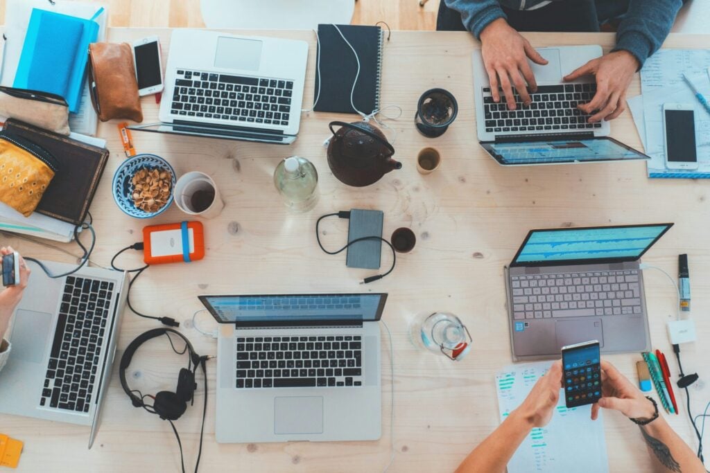 laptops, phones and tech on a table 